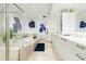 Elegant bathroom with a large soaking tub, double sinks, and a glass shower at 241 Riverside Dr # 2007, Holly Hill, FL 32117