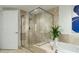 Modern bathroom with a walk-in shower and marble tile at 241 Riverside Dr # 2007, Holly Hill, FL 32117
