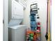 Stackable washer and dryer with storage shelving at 241 Riverside Dr # 2007, Holly Hill, FL 32117