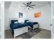 Twin bedroom with two beds, ceiling fan, and built-in wet bar at 241 Riverside Dr # 2007, Holly Hill, FL 32117