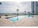 Inviting pool with a view of the water and a nearby bridge at 241 Riverside Dr # 2007, Holly Hill, FL 32117
