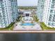 Aerial view of a condo complex with pool and waterfront access at 241 Riverside Dr # 2007, Holly Hill, FL 32117