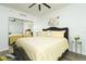 Main bedroom with a yellow comforter and gray upholstered bed frame at 241 Riverside Dr # 2007, Holly Hill, FL 32117