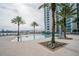 Resort-style pool with palm trees and a view of the waterfront at 241 Riverside Dr # 2007, Holly Hill, FL 32117