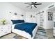 Spacious bedroom with king-size bed, barn door to closet, and white dresser at 241 Riverside Dr # 2007, Holly Hill, FL 32117