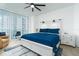 Bright bedroom with a king-size bed, balcony access, and modern nightstands at 241 Riverside Dr # 2007, Holly Hill, FL 32117