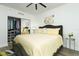 Bedroom with mirrored closet doors and a yellow comforter at 241 Riverside Dr # 2007, Holly Hill, FL 32117