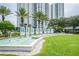 Community entrance with welcome sign and fountain at 241 Riverside Dr # 2007, Holly Hill, FL 32117