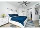 Spacious bedroom with king-size bed, barn door to closet, and white dresser at 241 Riverside Dr # 2007, Holly Hill, FL 32117