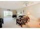 Spacious living room with a comfortable seating area and sliding glass doors at 1805 Turnbull Lakes Dr, New Smyrna Beach, FL 32168