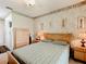 Bedroom with wood-toned furniture and an ensuite bathroom at 1805 Turnbull Lakes Dr, New Smyrna Beach, FL 32168