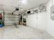 Spacious garage with overhead storage and ample space for vehicles and storage at 1805 Turnbull Lakes Dr, New Smyrna Beach, FL 32168
