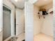 Bathroom with shower, walk-in closet, and tiled floor at 1805 Turnbull Lakes Dr, New Smyrna Beach, FL 32168