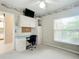 Bedroom with built-in desk and cabinets, offering ample storage at 1805 Turnbull Lakes Dr, New Smyrna Beach, FL 32168