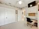 Bright bedroom with a large closet, desk and view of the bathroom at 1805 Turnbull Lakes Dr, New Smyrna Beach, FL 32168