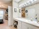 Bathroom with vanity, sink, and access to bedroom at 1805 Turnbull Lakes Dr, New Smyrna Beach, FL 32168