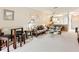 Living room features a round table with four chairs and a comfy sofa at 1805 Turnbull Lakes Dr, New Smyrna Beach, FL 32168