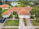 Attractive villa-style home with a two-car garage and golf course views at 1805 Turnbull Lakes Dr, New Smyrna Beach, FL 32168