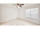 Spacious bedroom with ceiling fan and window with blinds at 1600 Big Tree Rd # D2, South Daytona, FL 32119