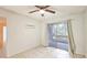 Bedroom with sliding doors leading to a balcony at 1600 Big Tree Rd # D2, South Daytona, FL 32119