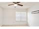 Bright bedroom featuring a ceiling fan and window with blinds at 1600 Big Tree Rd # D2, South Daytona, FL 32119