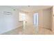 Bright living room with tile floors and access to other rooms at 1600 Big Tree Rd # D2, South Daytona, FL 32119
