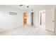 Bedroom with tile floors and access to other rooms at 1600 Big Tree Rd # D2, South Daytona, FL 32119