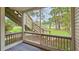Screened porch with view of stairs and trees at 1600 Big Tree Rd # D2, South Daytona, FL 32119