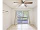 Bedroom with sliding glass doors to patio at 1600 Big Tree Rd # D2, South Daytona, FL 32119
