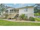 Two-story condo building with stairs and grassy area at 1600 Big Tree Rd # D2, South Daytona, FL 32119