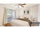 Virtually staged bedroom with balcony access at 1600 Big Tree Rd # D2, South Daytona, FL 32119