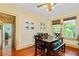 Charming dining room with hardwood floors and adjacent hallway view at 1206 S Riverside Dr, New Smyrna Beach, FL 32168