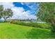 Relaxing waterfront view with lush landscaping and neighboring homes at 1206 S Riverside Dr, New Smyrna Beach, FL 32168