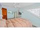 Bright bedroom with a double bed and ceiling fan at 1206 S Riverside Dr, New Smyrna Beach, FL 32168