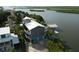 Elevated view of waterfront home, showcasing its location and dock at 824 Eel Ave, New Smyrna Beach, FL 32169