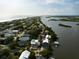 Bird's-eye view of a waterfront home nestled in a residential area at 824 Eel Ave, New Smyrna Beach, FL 32169