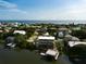 Elevated view of waterfront home and surrounding neighborhood at 824 Eel Ave, New Smyrna Beach, FL 32169