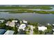 Bird's-eye view of waterfront home and its surroundings at 824 Eel Ave, New Smyrna Beach, FL 32169