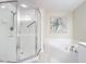 Bathroom with tub and walk-in shower at 426 Bouchelle Dr # 303, New Smyrna Beach, FL 32169