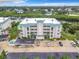 Three-story condo building with green roof and ample parking at 426 Bouchelle Dr # 303, New Smyrna Beach, FL 32169