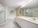 Double vanity, soaking tub, and walk-in shower at 426 Bouchelle Dr # 303, New Smyrna Beach, FL 32169