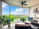 Relaxing screened balcony overlooking water view; comfy seating at 426 Bouchelle Dr # 303, New Smyrna Beach, FL 32169