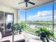 Peaceful balcony boasting water views and lush greenery at 426 Bouchelle Dr # 303, New Smyrna Beach, FL 32169
