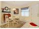 Charming breakfast nook with white table and chairs at 426 Bouchelle Dr # 303, New Smyrna Beach, FL 32169