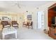 Bright living room with comfortable seating and views into dining and kitchen areas at 426 Bouchelle Dr # 303, New Smyrna Beach, FL 32169