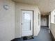 Condo entry with white door and neutral colored walls at 426 Bouchelle Dr # 303, New Smyrna Beach, FL 32169