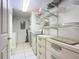 Bright laundry room with washer, dryer, shelving, and ample storage at 426 Bouchelle Dr # 303, New Smyrna Beach, FL 32169