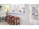 Kitchen with breakfast bar and three stools at 426 Bouchelle Dr # 303, New Smyrna Beach, FL 32169