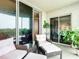 Serene balcony with seating and access to interior rooms at 426 Bouchelle Dr # 303, New Smyrna Beach, FL 32169