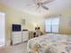 Bedroom with desk, dresser, and king-size bed at 426 Bouchelle Dr # 303, New Smyrna Beach, FL 32169